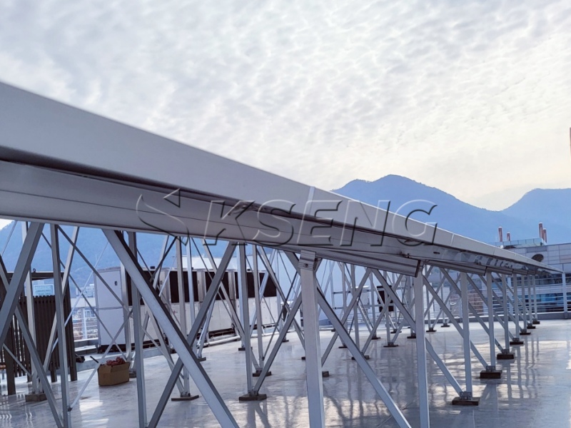 What are the advantages of installing distributed PV on industrial and commercial rooftops?